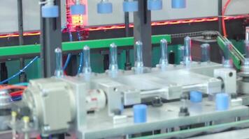 Demo making of PET or drinking water plastic bottle such as PET preform before automate heat blowing and shaping in molding machine and other process of making plastic bottles. Drinking water industry video