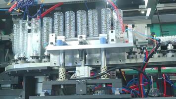 Demo making of PET or drinking water plastic bottle such as PET preform before automate heat blowing and shaping in molding machine and other process of making plastic bottles. Drinking water industry video
