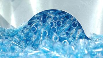 Demo making of PET or drinking water plastic bottle such as PET preform before automate heat blowing and shaping in molding machine and other process of making plastic bottles. Drinking water industry video