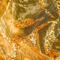 Golden abstract blur defocused background. Concept for New Years Eve, Christmas and happy holidays photo