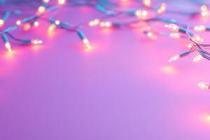 Glowing string lights scattered across a pastel pink background photo