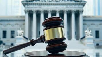 Gavel in front of courthouse symbolizing justice and law, suitable for Constitution Day content video