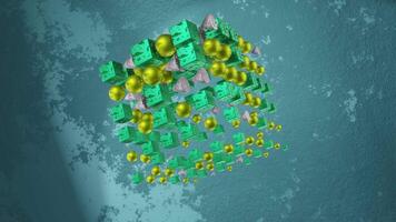 Looping VJ 3d animation. A rotating cube consisting of cubes, balls and cones, on the background video