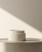 A white cosmetic plastic jar with lid on a soft shadow beige background mockup photo