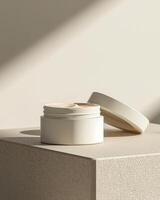 A white cream plastic jar with open lid on a soft shadow beige background packaging mockup photo