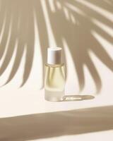 A bottle of perfume sitting on a table with a shadow of a palm tree photo