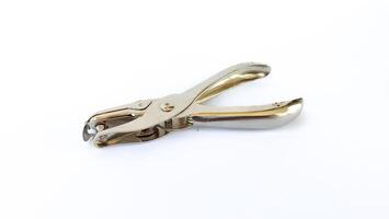 metal single paper hole puncher in white isolated background photo