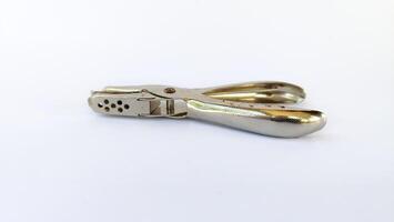 metal single paper hole puncher in white isolated background photo