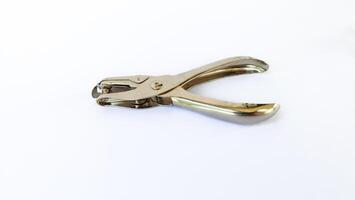 metal single paper hole puncher in white isolated background photo