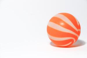 ittle orange ball isolated on a white background photo