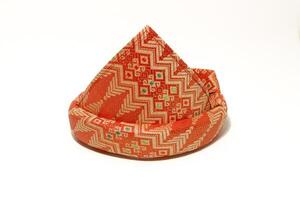 Tanjak is also known as traditional men's headgear in Palembang, South Sumatra. Tanjak is made from woven cloth with a Palembang songket pattern photo