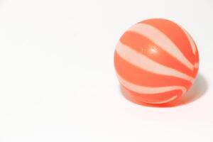 ittle orange ball isolated on a white background photo