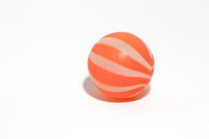 ittle orange ball isolated on a white background photo