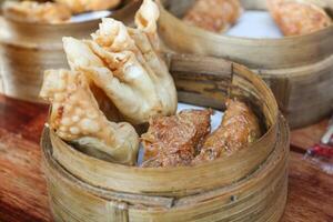 Gacoan noodles are a popular food in Indonesia. Made from noodles served with spicy spices and fried dumplings. photo