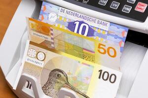 Dutch guilder in the counting machine photo