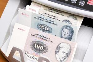 Old Danish krone in the counting machine photo