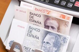 Spanish peseta in the counting machine photo