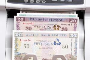 Irish pound in the counting machine photo