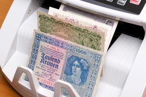 Old Austrian crown in the counting machine photo