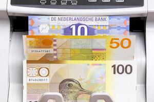 Dutch guilder in the counting machine photo