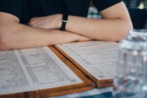 a young man enjoys a meal in a Greek restaurant photo