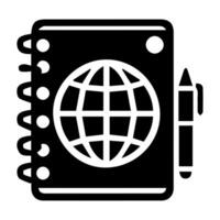 A notebook with a globe and pen on it vector