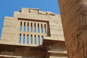 Part of the wall and column at the ancient egyptian temple, in Luxor, Egypt. photo