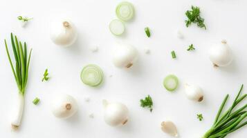 Fresh spring onions and green herbs on a white background. Culinary and organic gardening concept photo