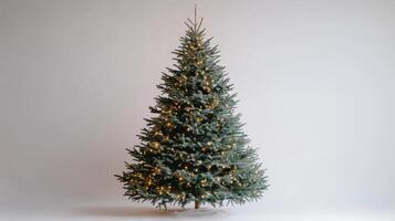 Christmas tree with lights on white background, holiday decoration concept photo