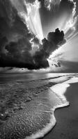 Dramatic sky with sun rays over ocean shore, monochrome seascape. Serenity and nature concept photo