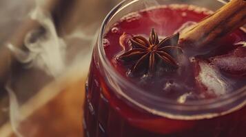 Hot mulled wine with cinnamon and star anise, cozy autumn beverage concept photo