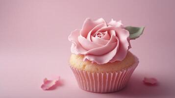 Cupcake with pink rose frosting on pastel background, dessert and confectionery art concept photo