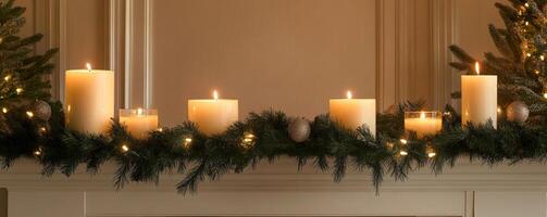 Festive candles on mantel with evergreen garland, warm ambiance. Holiday decoration and cozy atmosphere concept photo