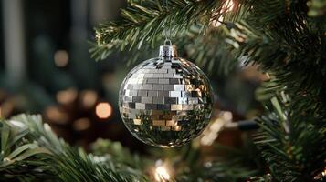 Christmas tree with disco ball ornament and lights, festive holiday decoration concept photo