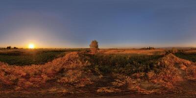 Spherical HDRi panorama of rural agricultural fields area at summer sunset photo