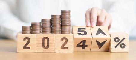 2024 to 2025 New year with percentage change to UP and Down arrow with coin stack. Interest rate, GDP, stocks market, financial, deflation and Inflation, mortgage, debt, Loan and Economic Recession photo