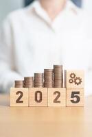 Happy New Year 2025 with Coins stack and gear icon. business Process, Team, teamwork, Strategy, goal, Money, Budget, investment, financial and New Year Resolution concept photo