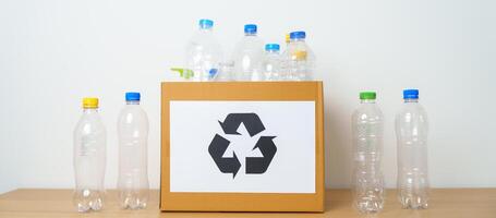 Plastic bottle in paper box at home or office. Recycle garbage Sorting. Plastic Free, Ecology, Environmental, pollution, Dispose recycling, waste management and trash Separation concept photo