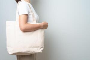 Woman with Eco Shopping tote bag with Copy space for text. Environmental Protection, Zero waste, Reusable, Say No Plastic, Sustainability, Eco Friendly, World Environment day and Earth day concept photo
