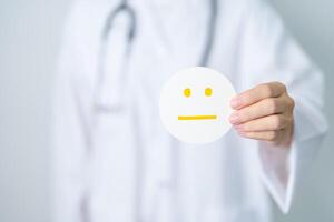 Doctor show Emotion face paper, Mental health Assessment, Psychology, Health Wellness, Feedback, Customer Review, Experience, Satisfaction Survey, World Mental Health day concept photo