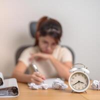 stressed Woman with mistake paper and clock, Tired female businesswoman working overload at office, Exhausted woman with document folder stack at late night in home. Failure, Problem and business photo