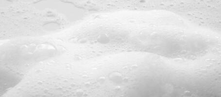 Abstract white soap foam bubbles texture background photo