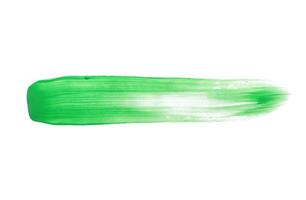 Green brush stroke isolated on white background photo