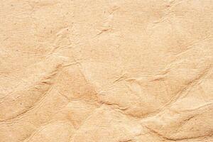 Abstract crumpled and creased recycle brown paper texture background photo