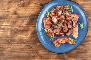Plate of dates and bacon photo