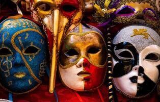 shop in italy close up three typical venetian masks with intricate decorations and details photo