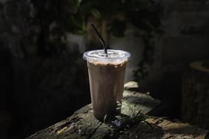 Iced cocoa smoothie in a plastic cup photo