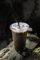 Iced cocoa smoothie in a plastic cup photo