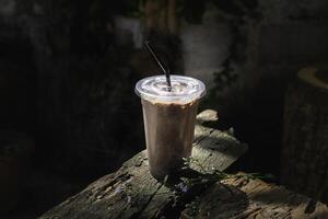 Iced cocoa smoothie in a plastic cup photo