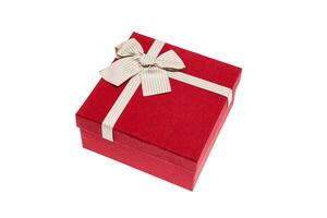 Red gift box with gold ribbon and bow isolated on white background photo